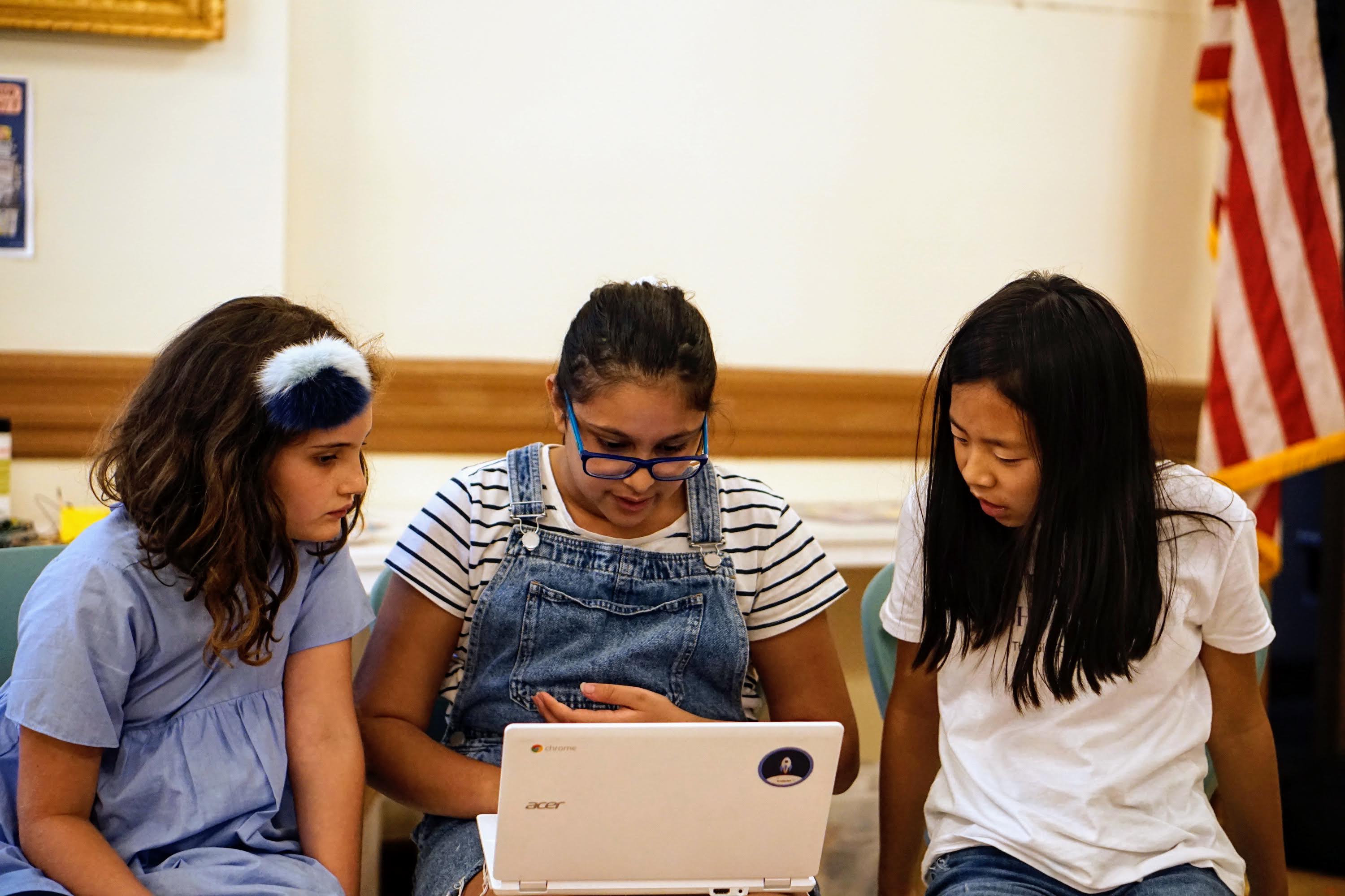 students coding at camp
