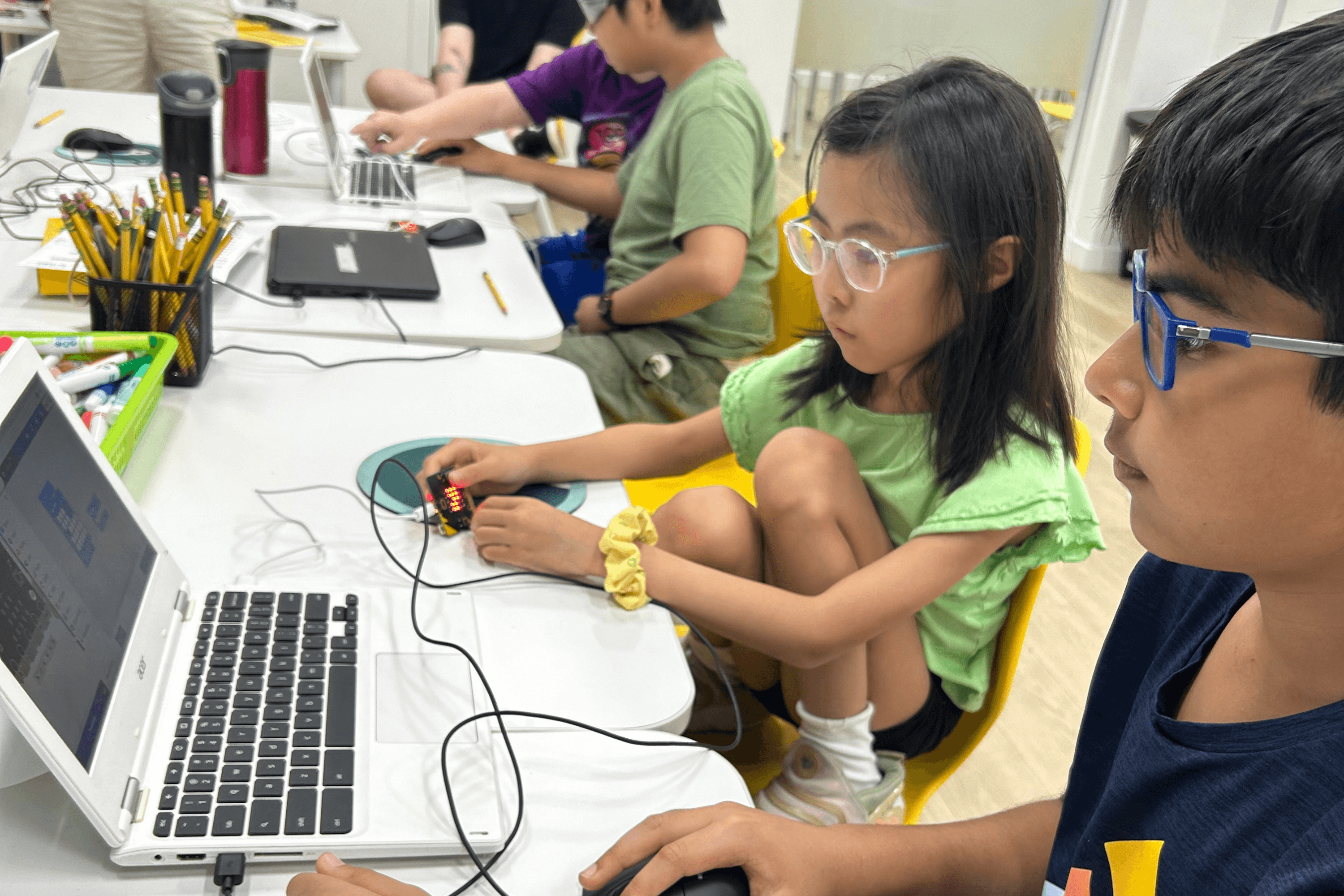 Students coding at camp