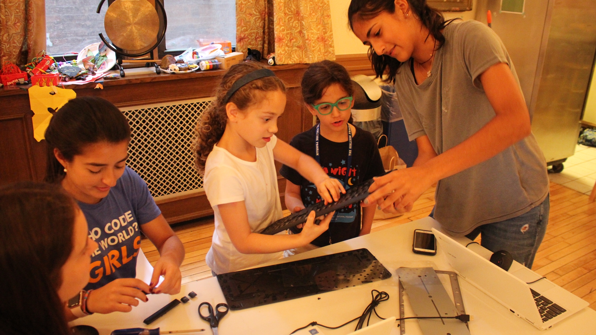 Girls taking apart computer