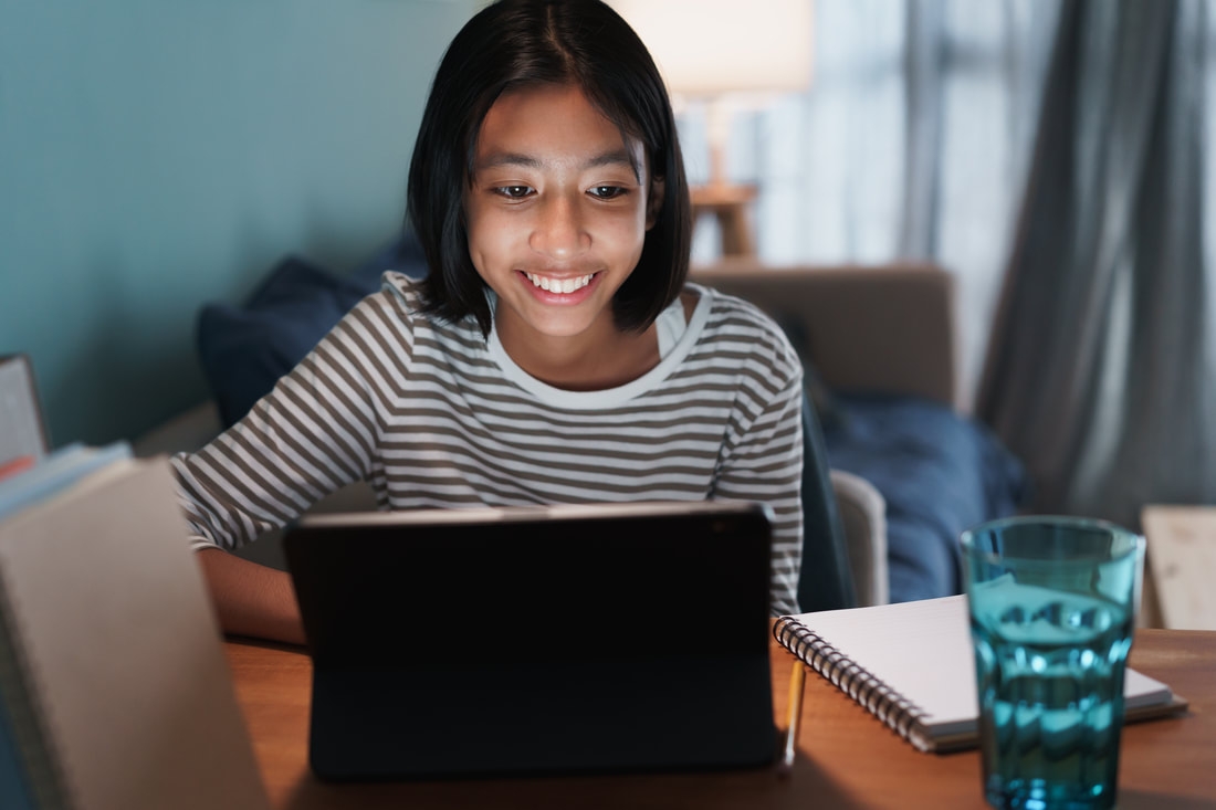 Student learning on a tablet